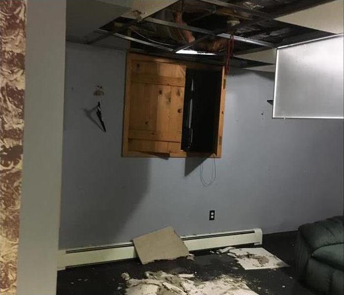 a ceiling blown out from a storm 