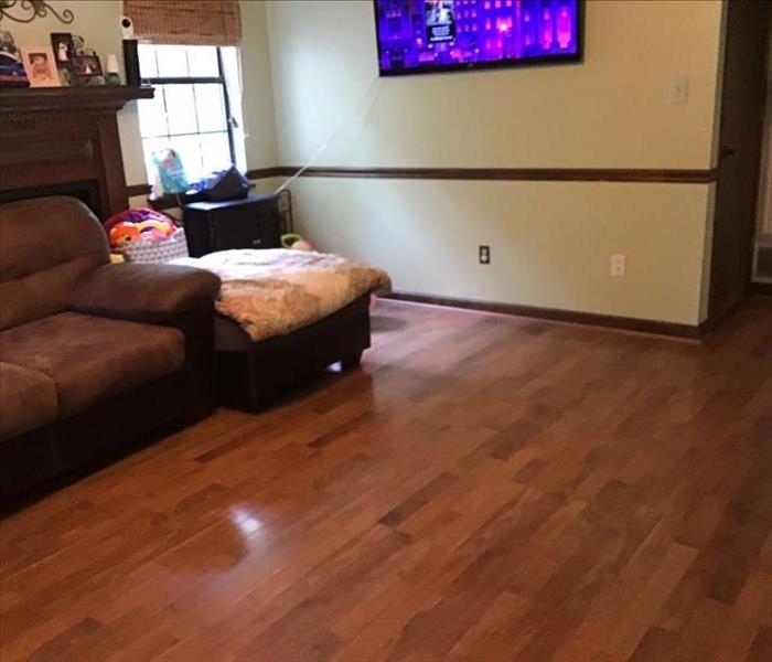 living room, like-new hardwood flooring, brown sofa