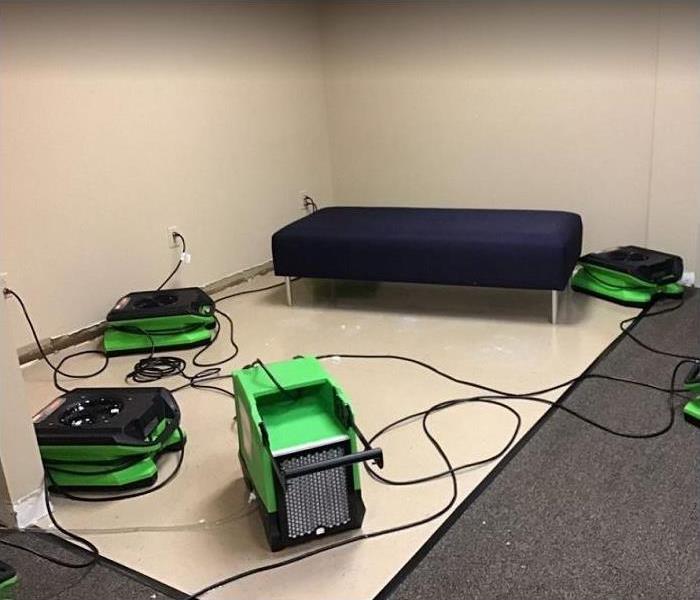 SERVPRO drying equipment being used on water damaged carpet